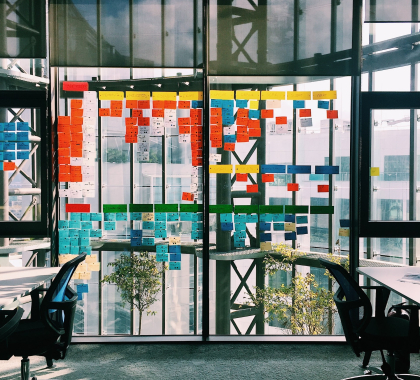 post it notes on a glass wall